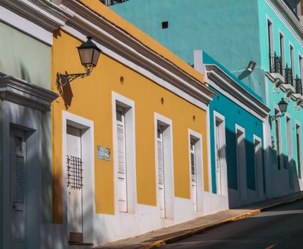 A vibrant street view showcasing colorful colonial buildings with a sunny ambiance.