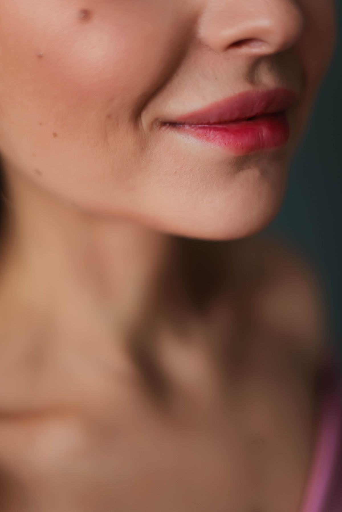 Detailed close-up of natural, rosy-cheeked skin showing a soft gel-cream blush finish over a cream base