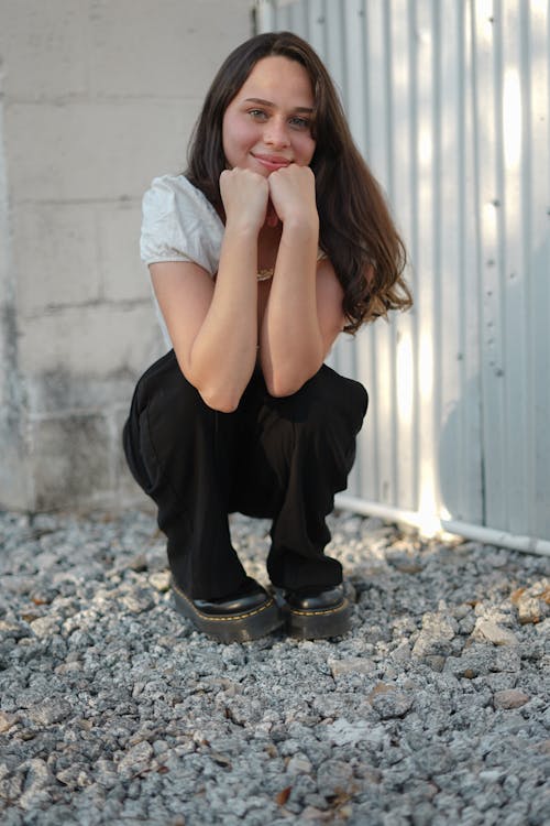 Woman in Boots Sitting