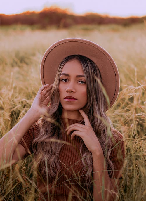 Blonde Woman in Hat on Field