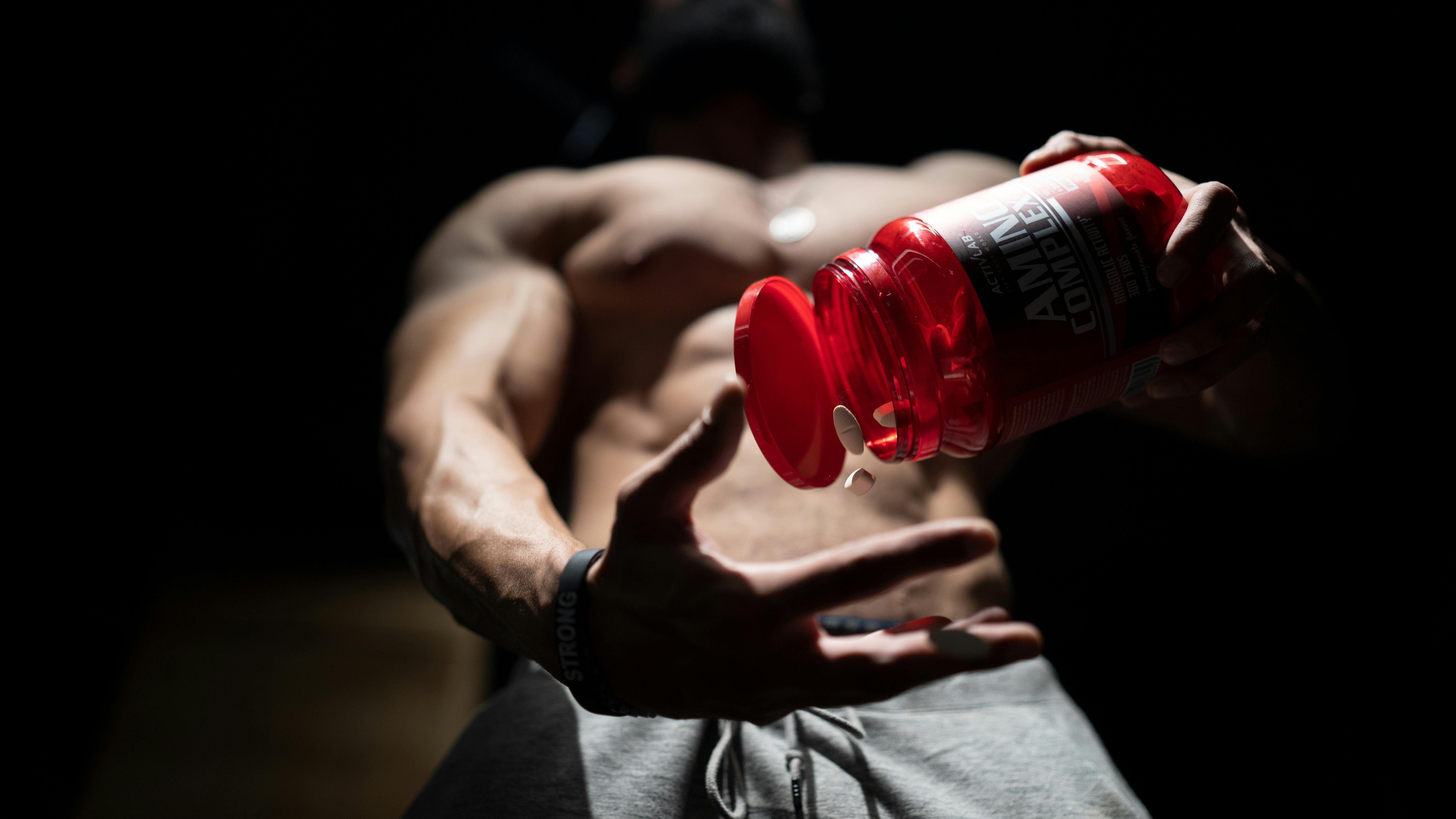 Muscular Man with Jar · Free Stock Photo