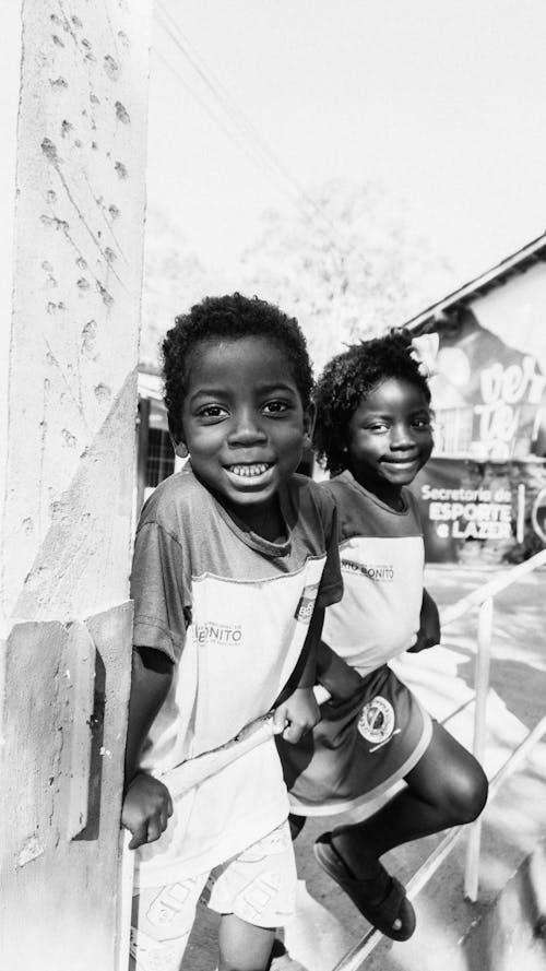 Faces of Smiling Children in Black and White