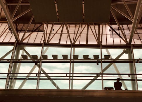 Silhouette of a person in Buenos Aires Ezeiza Airport's modern architectural design.