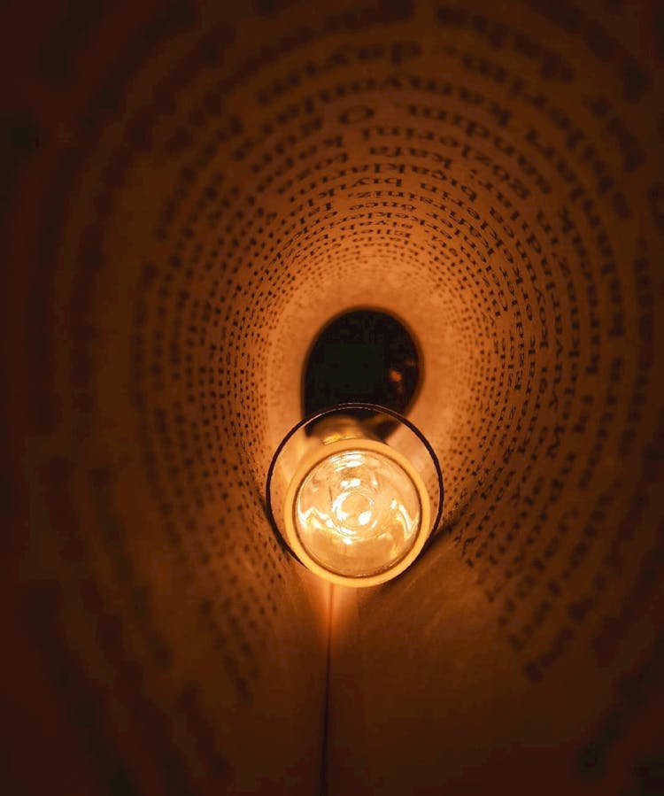 Lamp Between Folded Book Page