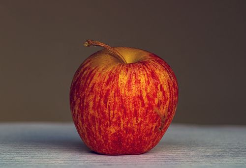 Free Close-up of a red apple captured in studio lighting, showcasing natural texture. Stock Photo