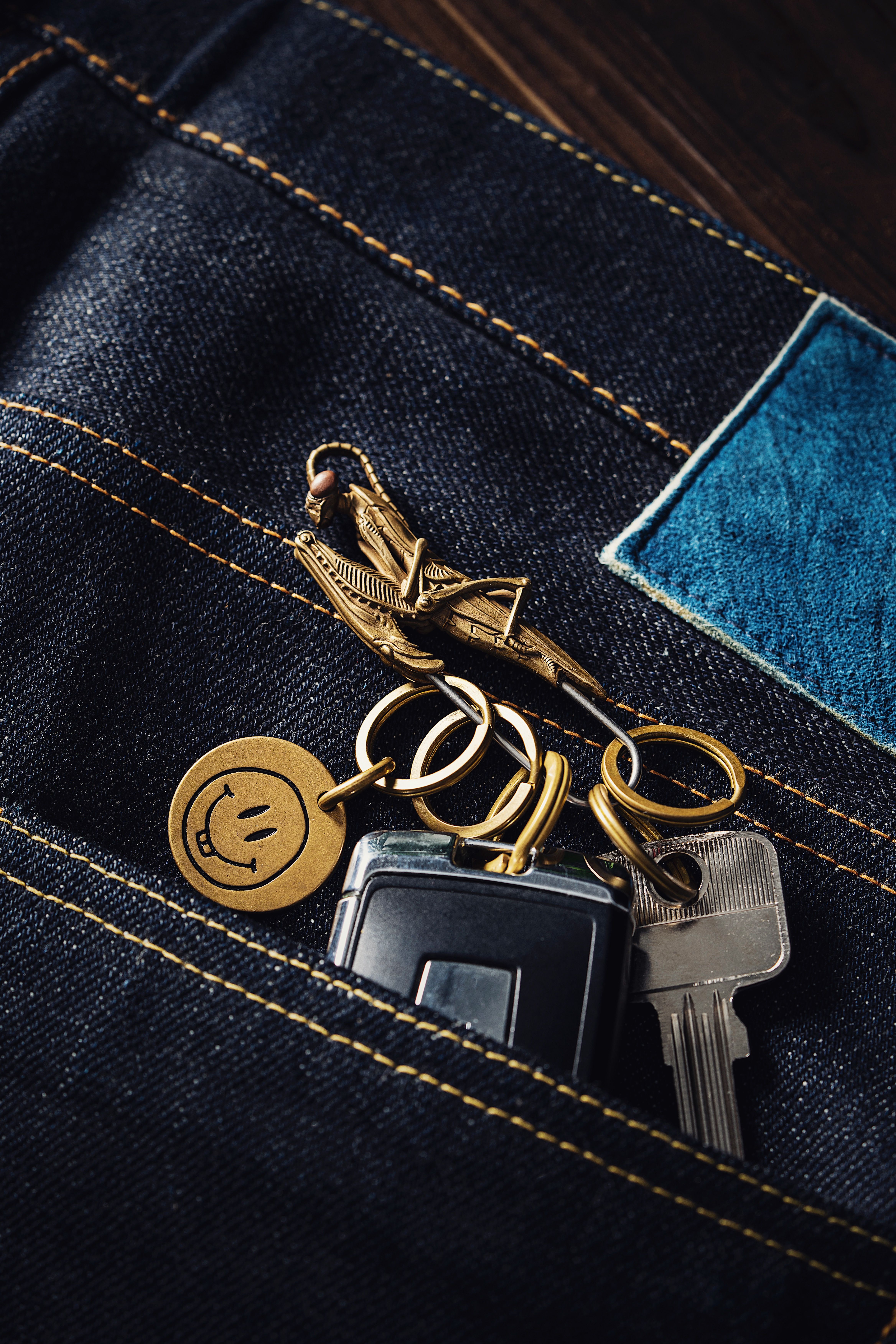 Mantis-shaped Clip with Keychains and Smiley Pendant on Jeans · Free ...