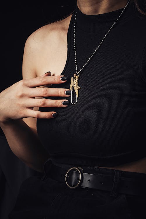 Woman in Black Top with Pendant in Shape of Praying Mantis