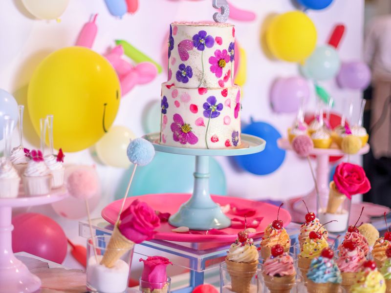 Birthday cake with balloons and decorations for children
