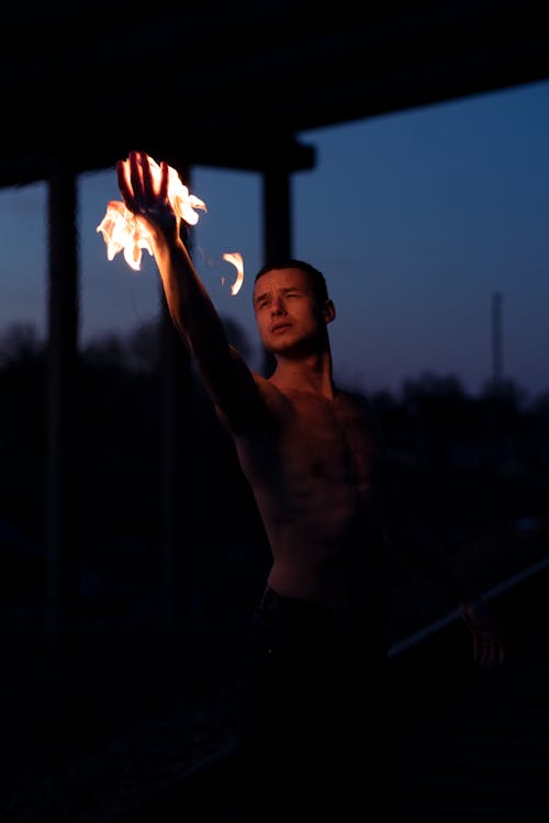 Topless Man with Flame on Hand