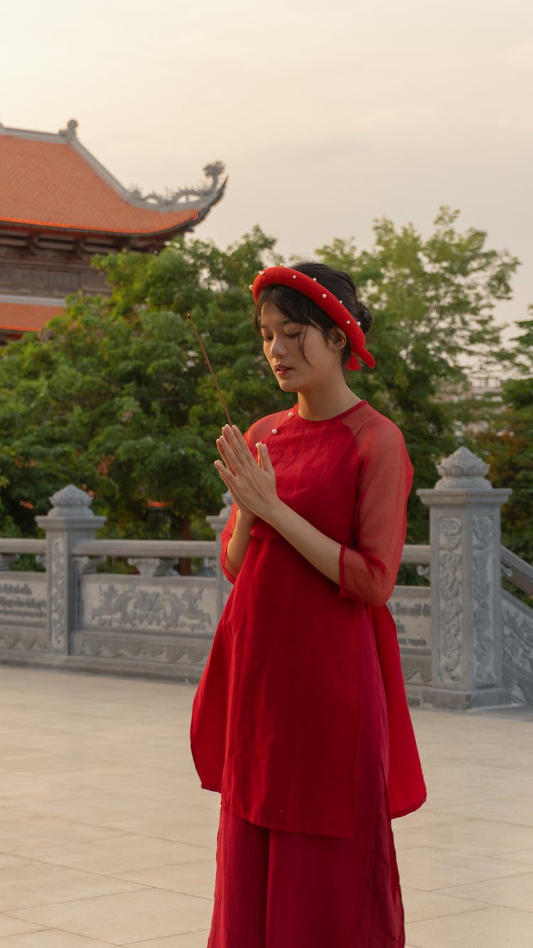 Woman In Red Dress Praying