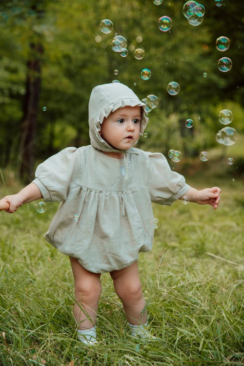 Baby in Hood and Bubbles around