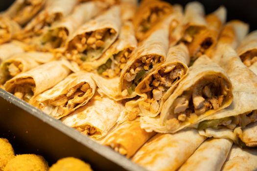 Appetizing close-up of chicken wraps showcasing savory ingredients in tortillas.