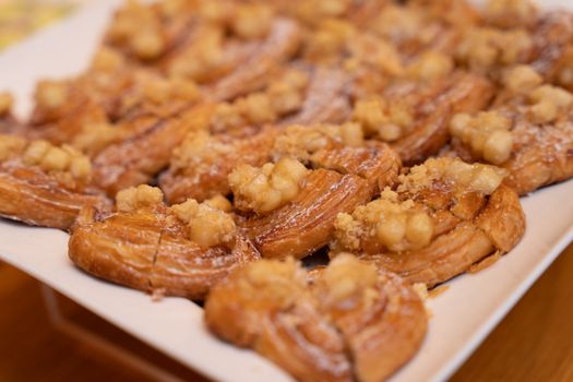 Close-up of freshly baked apple pastries topped with cinnamon, perfect for dessert.