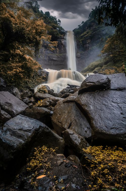 Free Stunning waterfall cascading through lush forest in West Java, Indonesia. Stock Photo