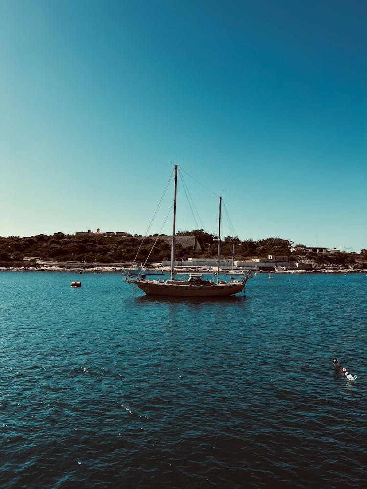 Sailboat In The Middle Of The Bay