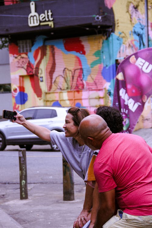 Couple Taking a Picture on a Street 