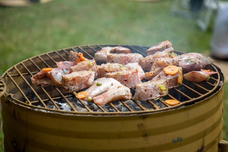 Fish And Vegetables Frying On A Grill