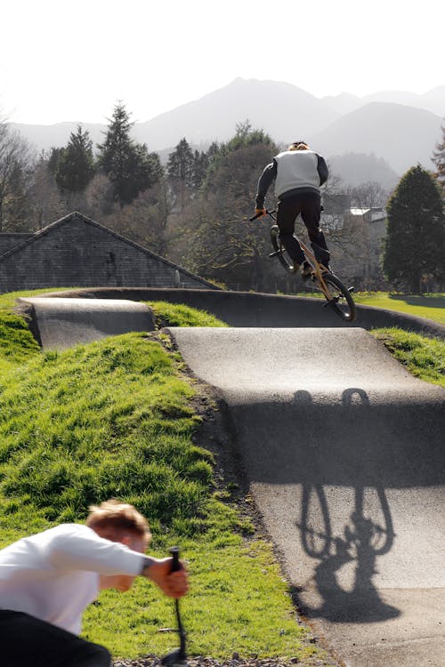 Man Riding a BMX Bike in a Skatepark 