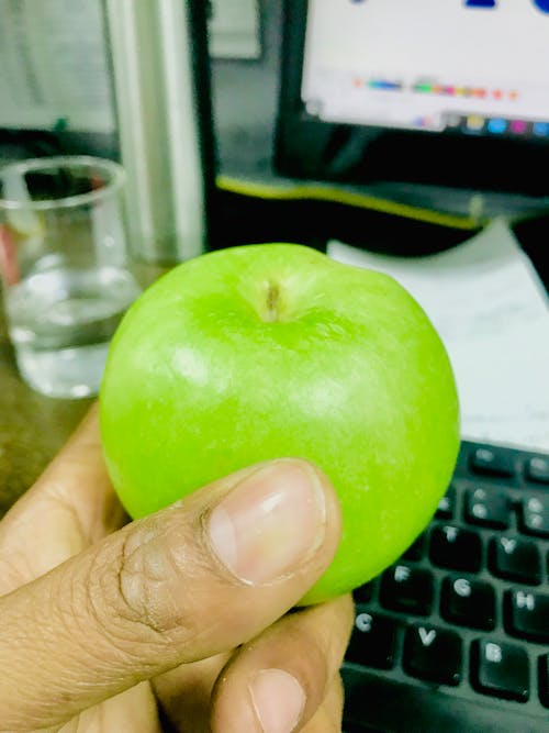 Green Apple in Hand 