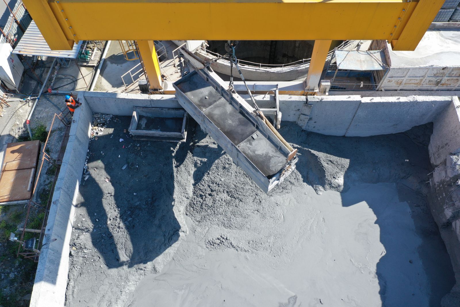 Gantry crane pouring concrete into foundation pit — Google Business Profile Messaging: Turn It On or Off?
