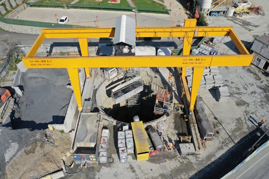 Aerial image of an active construction site in Eyüpsultan, İstanbul featuring cranes and machinery.