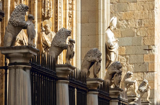 Detailed view of historic lion sculptures and religious statues at Toledo Cathedral, Spain.
