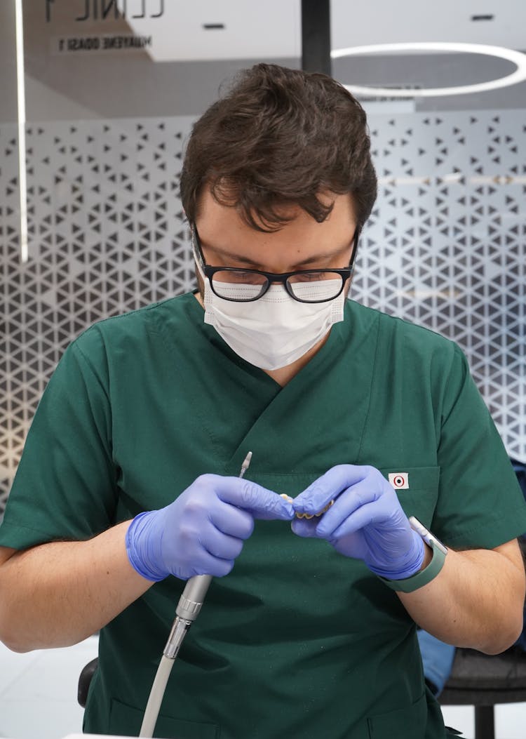 Doctor Wearing Gloves And Face Mask