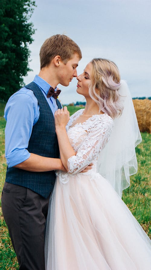 Newlyweds in Shirt with Vest and in Wedding Dress