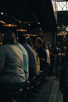 A group of people enjoying a relaxed evening at a cozy bar in Buenos Aires, Argentina.
