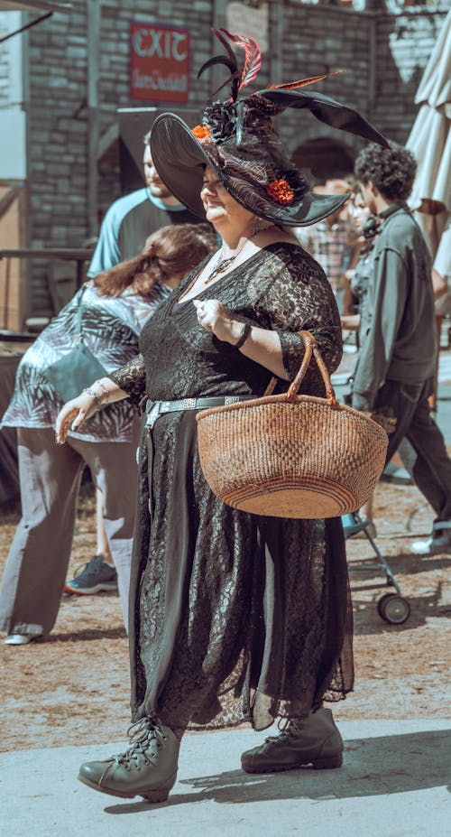 Woman in a Halloween Costume Walking on the Street