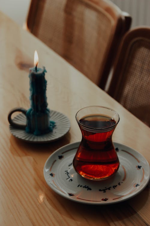 Turkish Tea and Wax Candle on Table