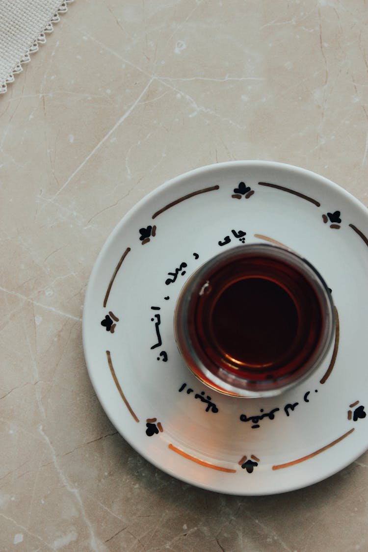 Coffee In Glass On Plate