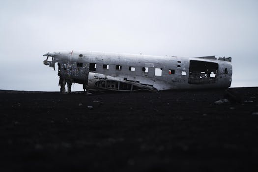 Famous abandoned plane wreck on a desolate Icelandic black beach.