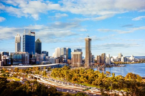 Free A stunning aerial view of Perth's skyline with modern skyscrapers and the Swan River on a sunny day. Stock Photo