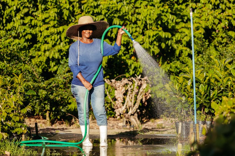 Farmer With Hose