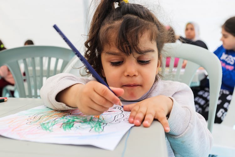 Girl Coloring With Pencil