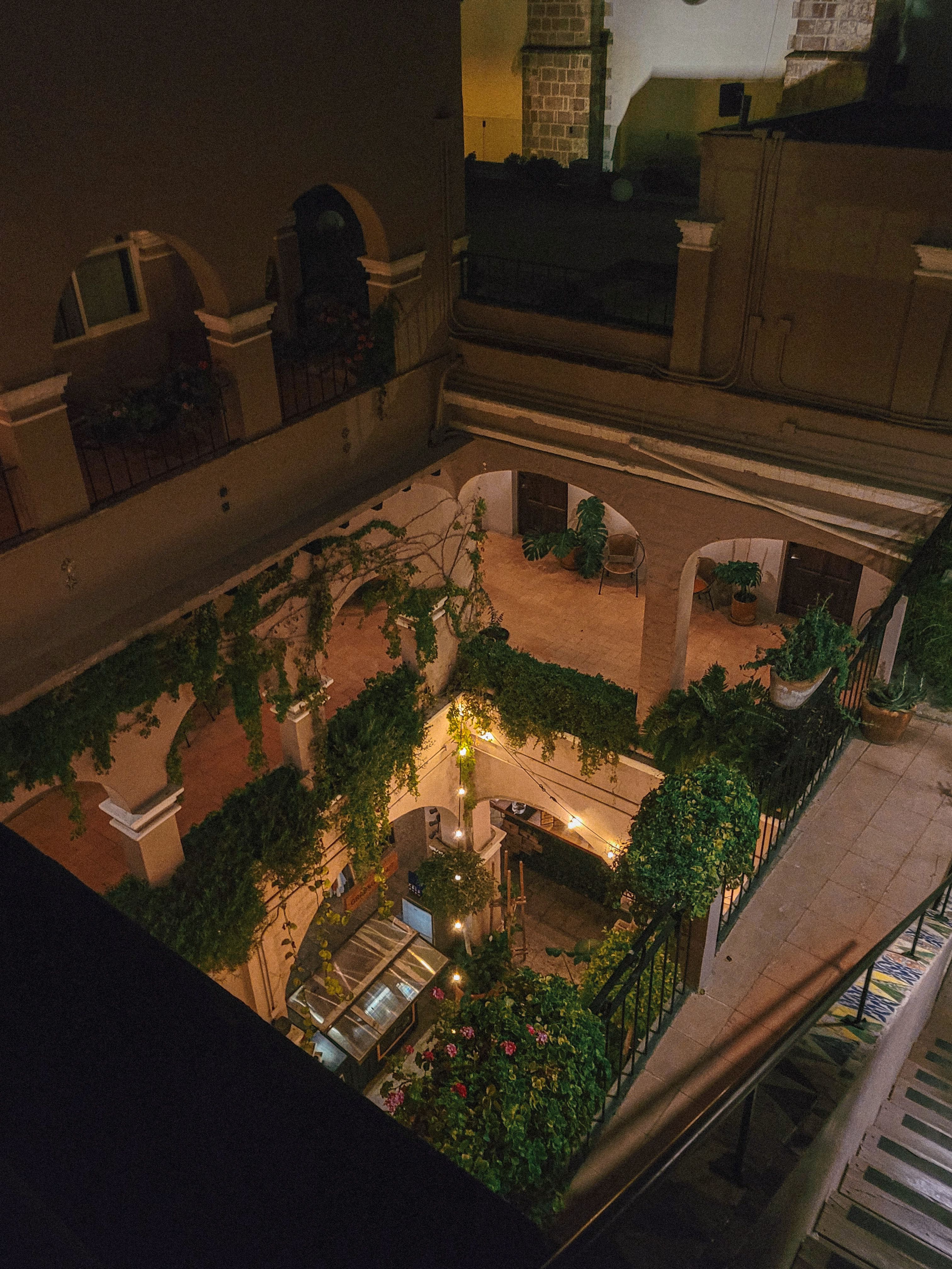 The courtyard at night under the arches