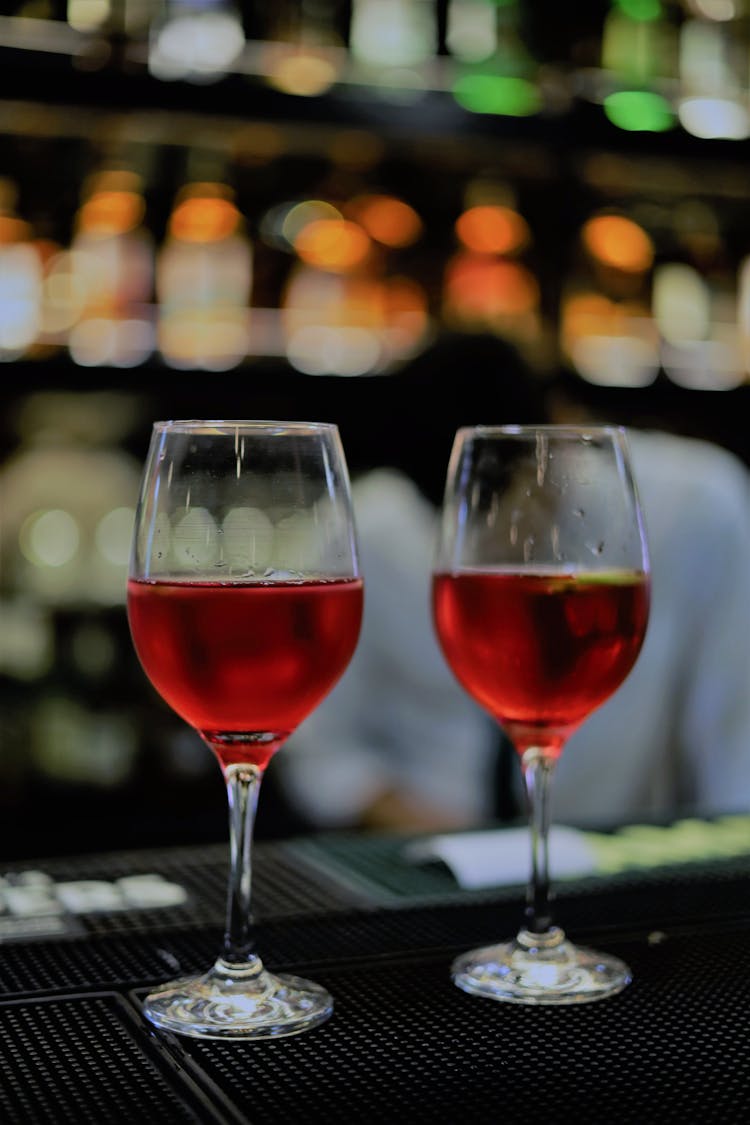 Glasses With Alcohol On Bar Counter