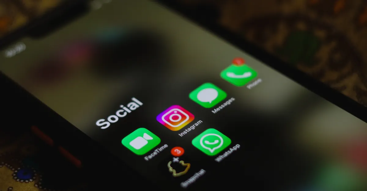 Smartphone showing social media feeds, representing online speech and government fact-checking