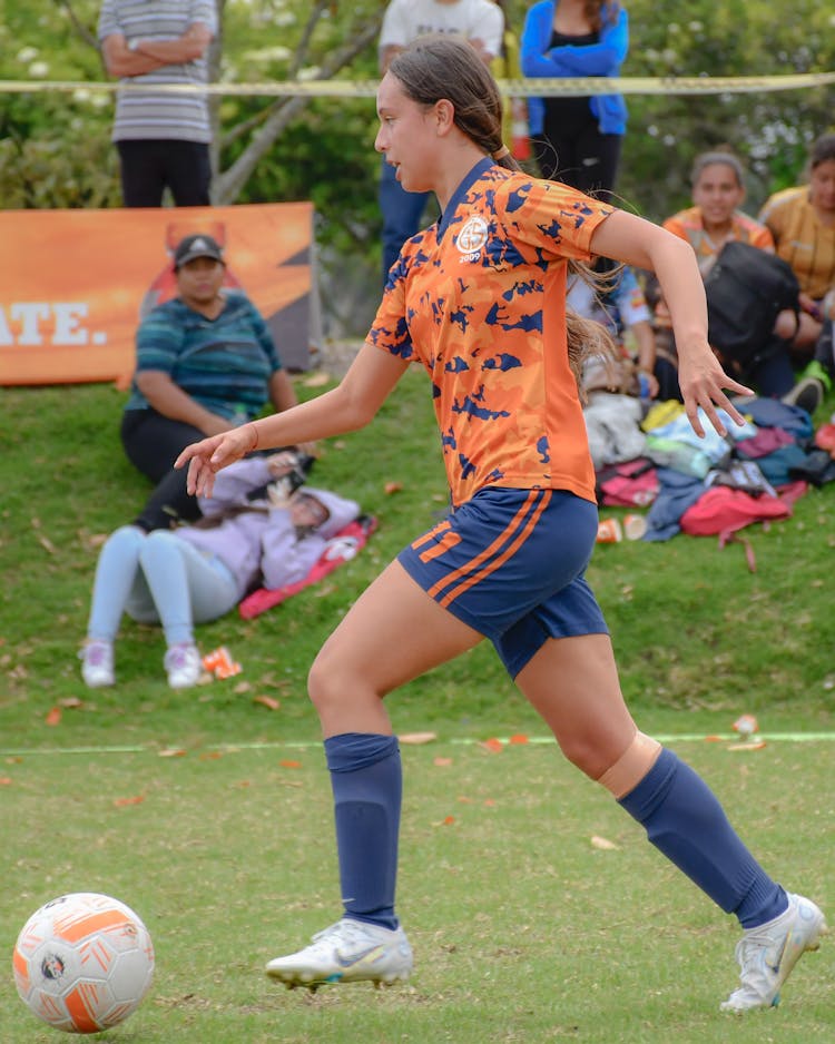 Girl Playing Football