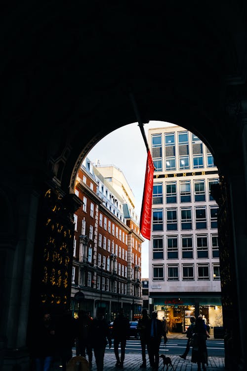 Peple behind Tunnel near Street