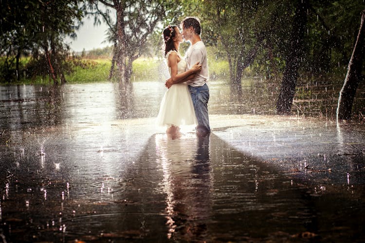 A Couple Kissing In The Rain 