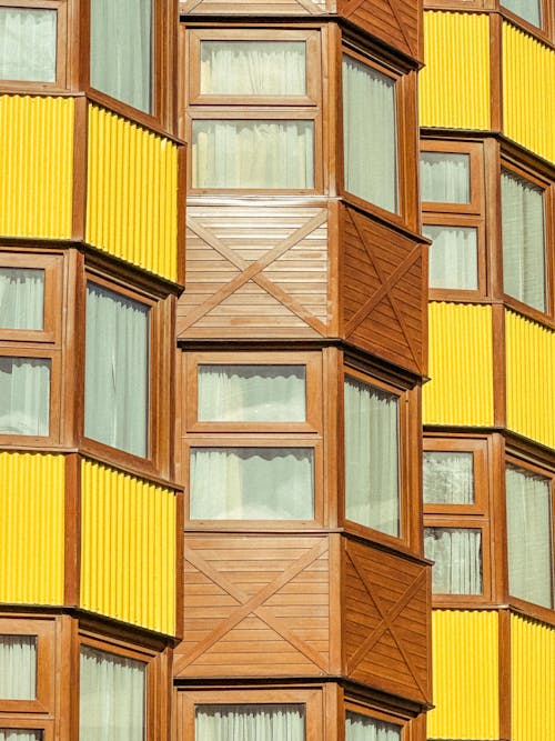 Windows and Wooden Exterior of Apartment Building