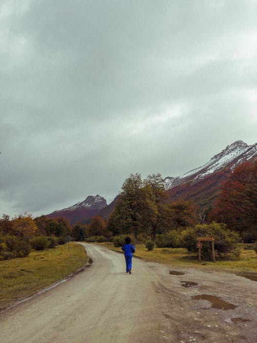 A Person Jogging in Mountains 