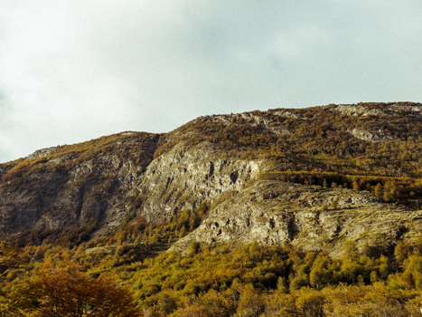 Breathtaking view of rocky mountains and autumn foliage in Ushuaia, Argentina.