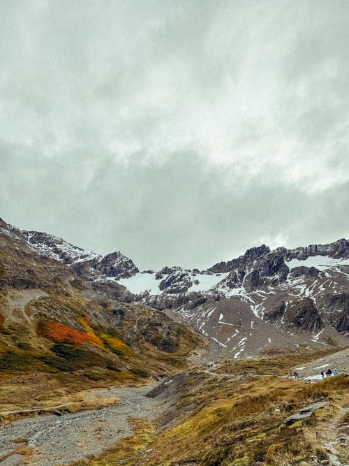 A Trail in Rocky Snowcapped Mountains 