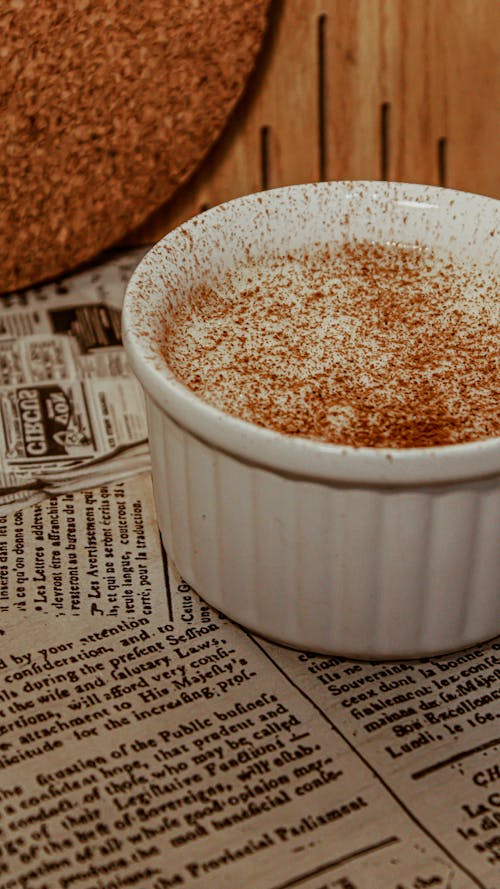 Free Cream with Cocoa Powder in White Bowl Stock Photo