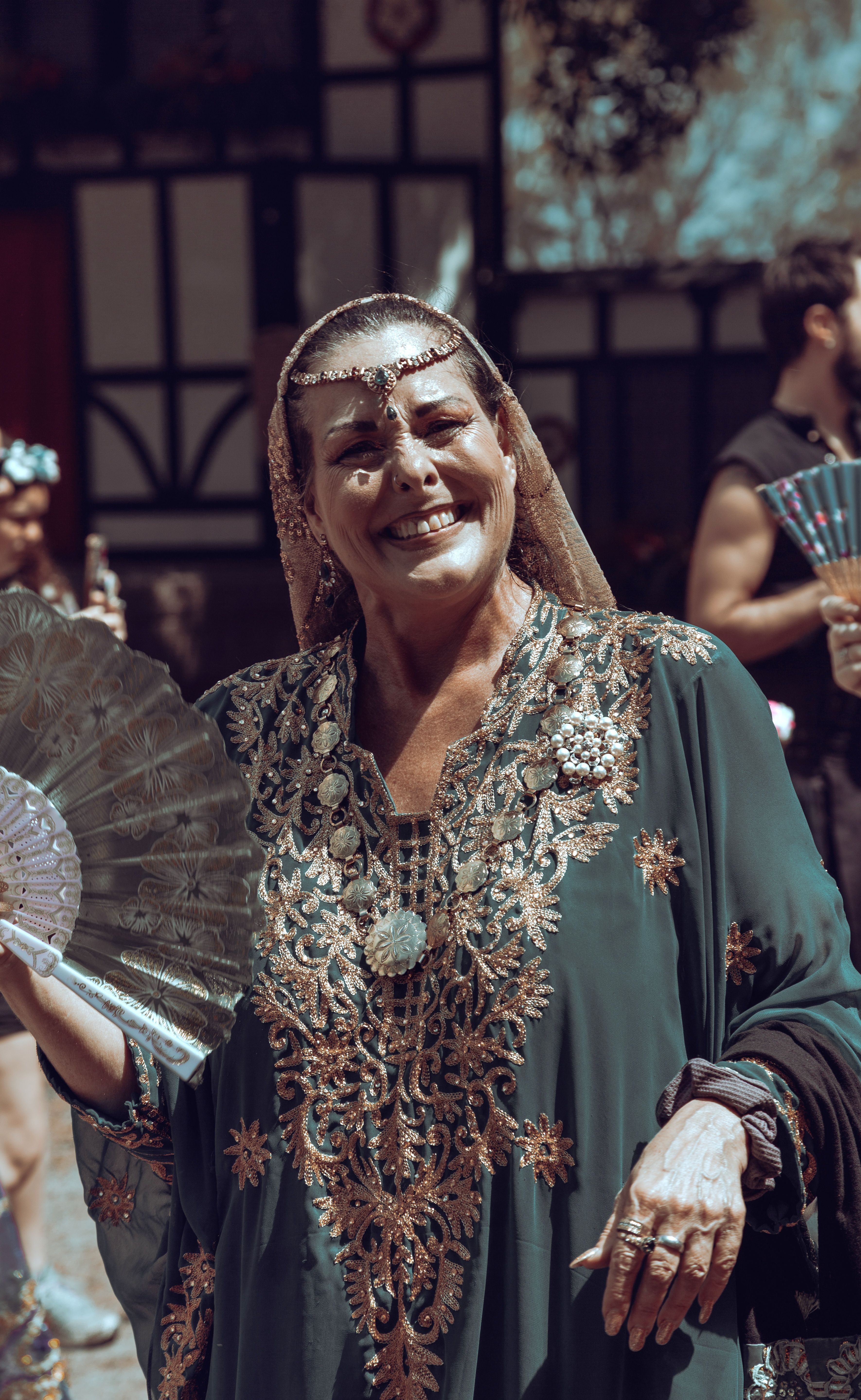 Smiling Woman Posing in Traditional Clothing · Free Stock Photo