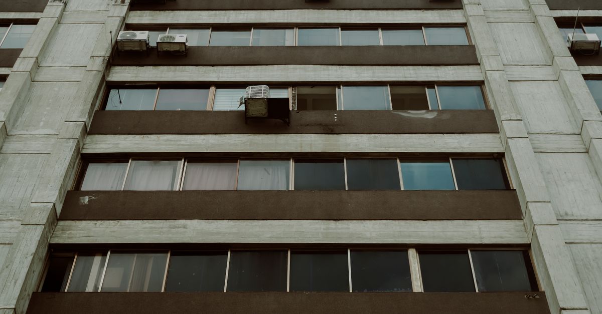 Low angle view of a modern apartment building facade with windows, Mérida, Venezuela.