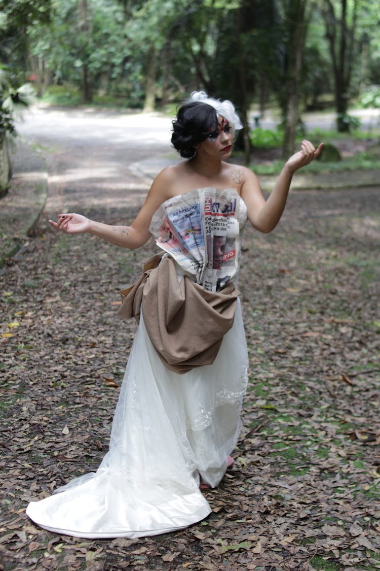 Woman In Wedding Dress And Newspaper